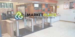 Turnstiles in a leisure centre with the Gladstone Marketplace logo